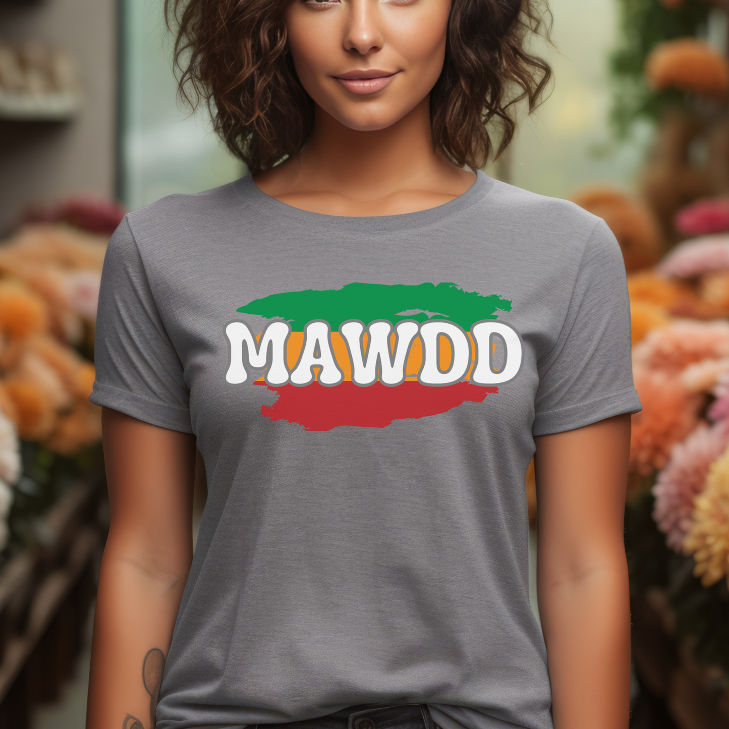 Woman wearing a gray t-shirt with 'MAWDD' logo in a flower shop