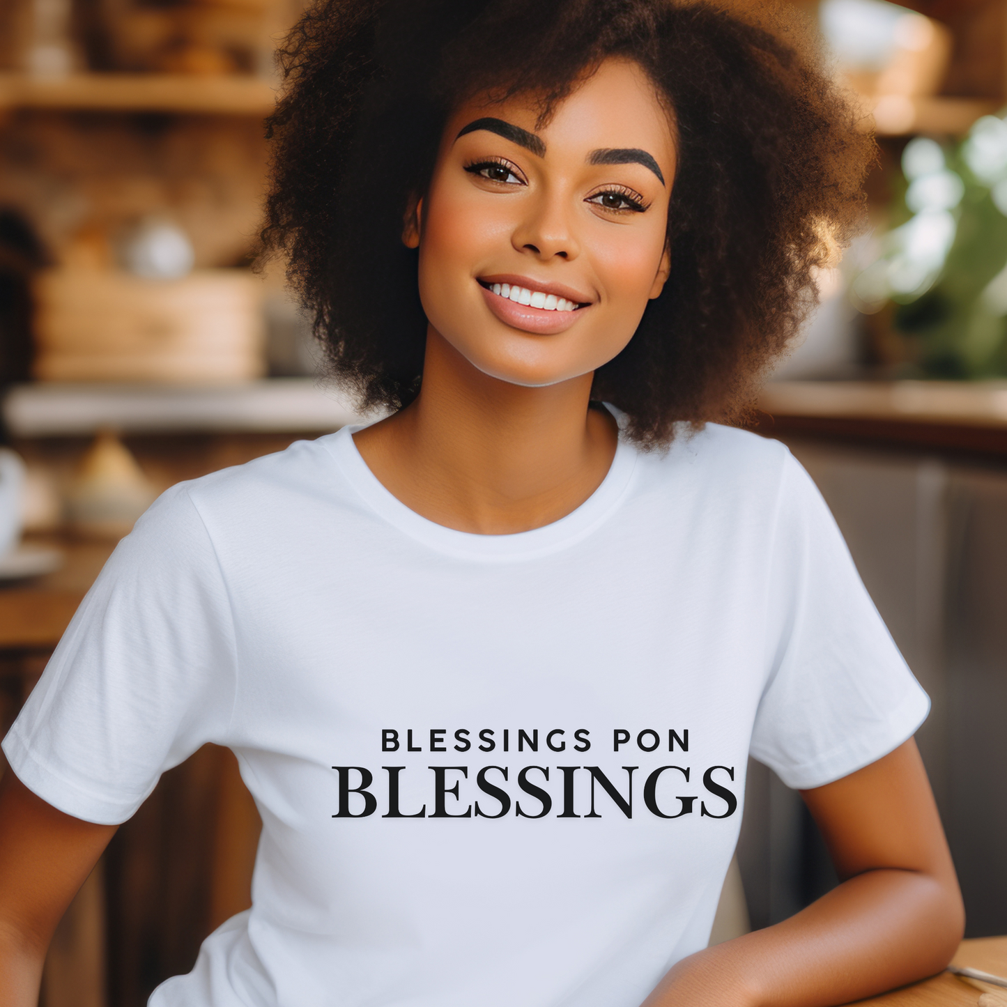 Woman wearing a white t-shirt with 'Blessings Pon Blessings' text in a casual setting.