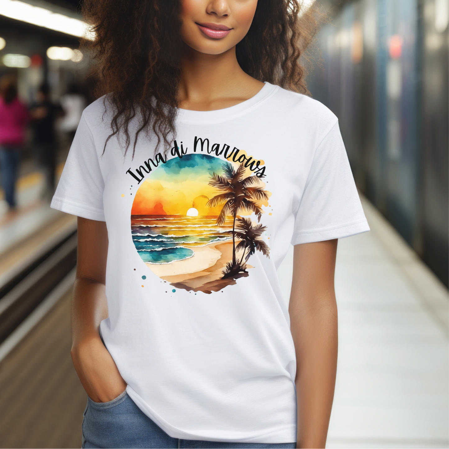 Woman wearing a white t-shirt with a beach graphic on a subway platform