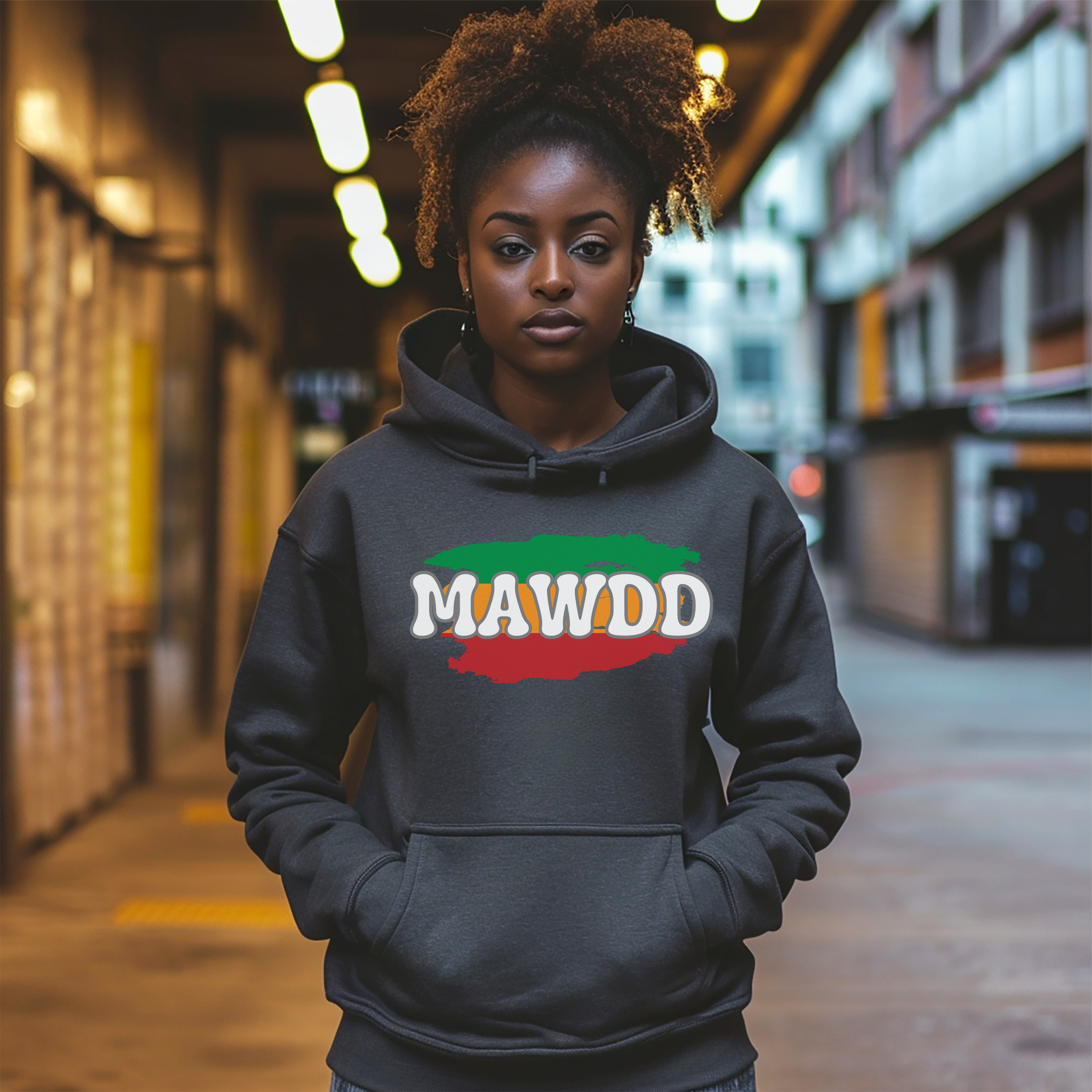 Person wearing a dark hoodie with 'MAWDD' printed on it in an urban setting