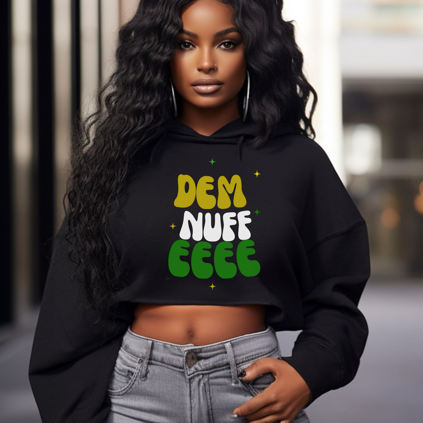 Woman wearing a black hoodie with text "Dem Nuff EEE", standing on a street.